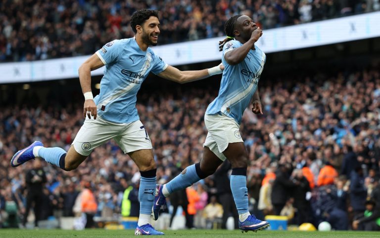 Doku magic earns win for Man City to keep heat on Arsenal