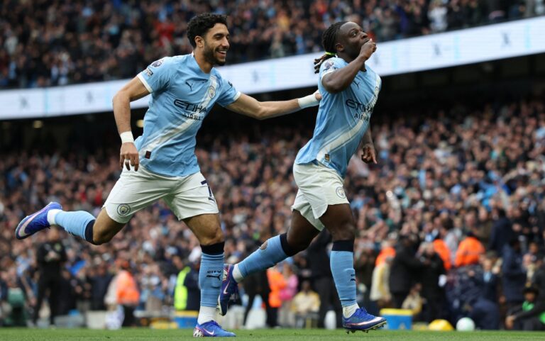 Doku magic earns win for Man City to keep heat on Arsenal